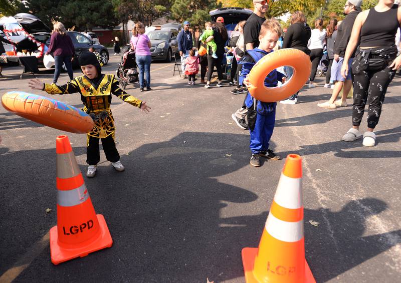Luca (left) and Jaxson Gebhart of Countryside play one of the games on Saturday, Oct. 12, 2024 during a Trunk or Treat event at Sedgwick Park in La Grange.