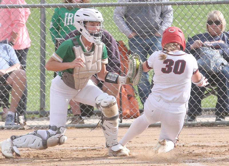 Seneca catcher Lexie Buis tags out Ottawa's Aubrey Sullivan on the arm while running home on Friday, May 2, 2025 at Ottawa High School.