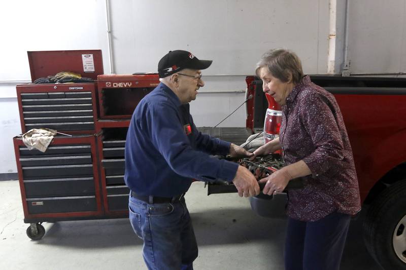 Barbara Christ is handed a tool drawer by shop manager Bob Keller as he packs up his tools Tuesday, March 14, 2023, at B&K Power Equipment in Marengo. Christ has decided to close the business after 53 years. It was one of the last independent farm and construction machinery shops in the area.