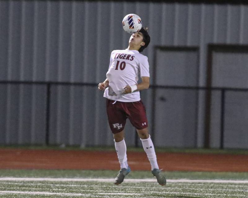 Plainfield North's Luis Sanchez (10) heads the ball during Class 3A Naperville Central Regional semifinal soccer match between Plainfield North at Oswego, Tuesday Oct 21, 2025.