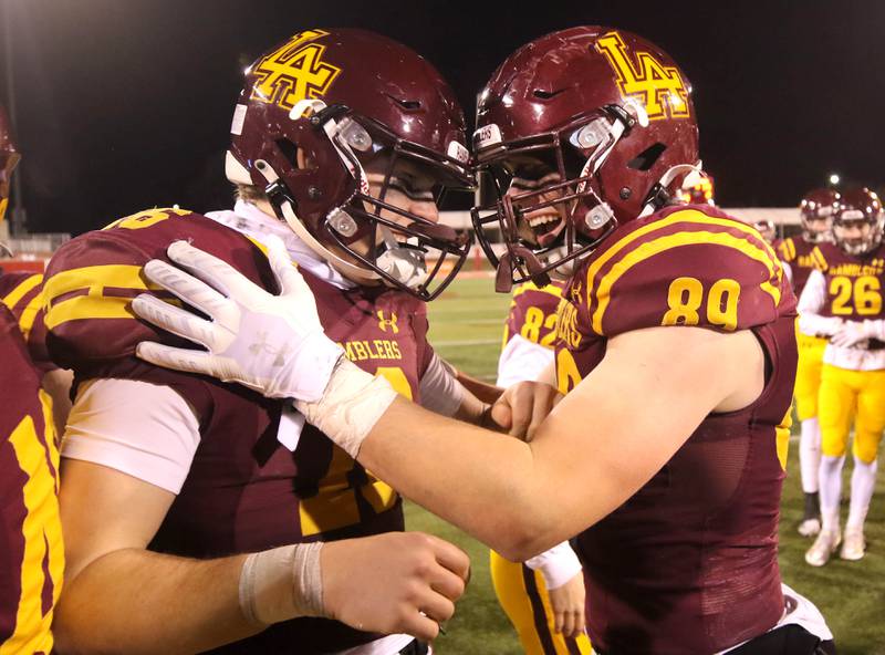 Loyola Academy players celebrate after their Class 8A state championship game win over York Saturday, Nov. 30, 2024, in Hancock Stadium at Illinois State University in Normal.