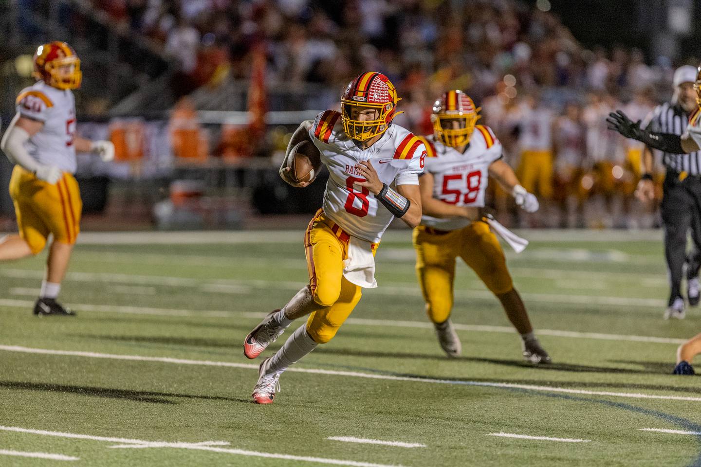 Batavia's Michael Vander Luitgaren looks runs the ball against St. Charles North on Friday, Sept. 26, 2025 in St. Charles.