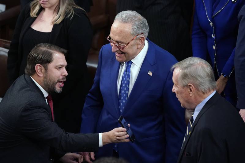Rep. Ruben Gallego, D-Ariz., left, speaks with Senate Majority Leader Chuck Schumer of New York and Sen. Dick Durbin, D-Ill., in the House Chamber before President Joe Biden arrives to deliver his State of the Union speech to a joint session of Congress, at the Capitol in Washington, Tuesday, Feb. 7, 2023. (AP Photo/J. Scott Applewhite)