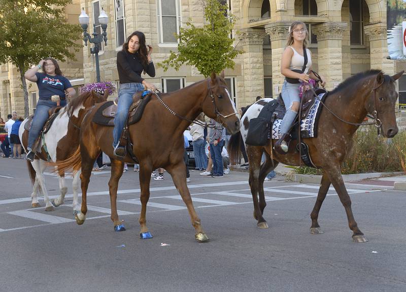 Ottawa High School FFA members close the Homecoming Parade on horseback Wednesday evening in Ottawa.