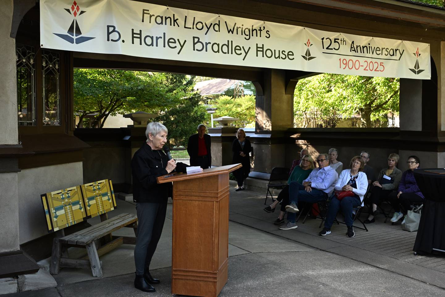 Wright in Kankakee board secretary Lynn Ahlden reads the inscription of the the newly rededicated Stephen Small memorial plaque on Sunday, Oct. 12, 2025.