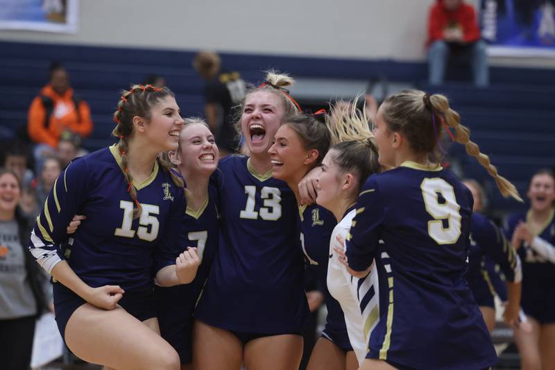 Lemont celebrates match point against Providence in the Class 3A Providence Sectional semifinal on Monday.