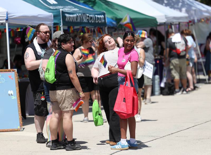 Visitors check out some of the booths Saturday, June 21, 2025, during the DeKalb Pride Fest in front of the Egyptian Theatre in DeKalb.