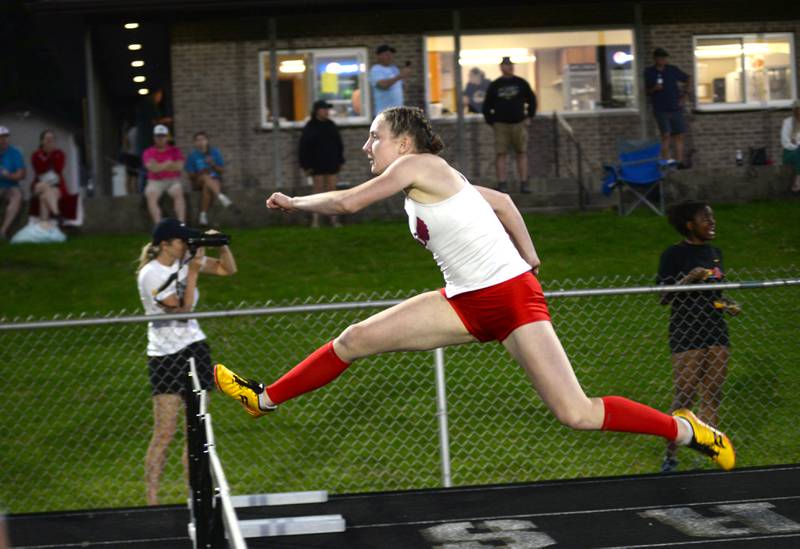 Oregon's Jillian Hammer clears a hurdle in the home stretch of the 300 hurdles to finish first at the 1A Lena-Winslow sectional on Thursday, May 15, 2025. She will compete at the state meet this week at Eastern Illinois University in Charleston.