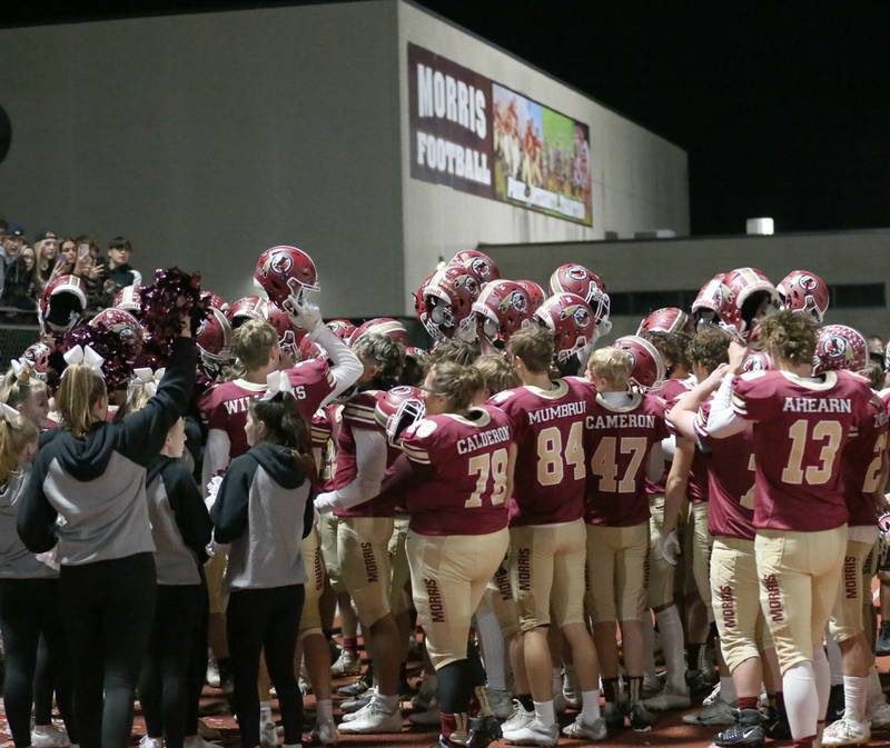 Members of the Morris football team celebrate after defeating L-P in the Class 5A round one football game on Friday, Oct. 28, 2022 in Morris.