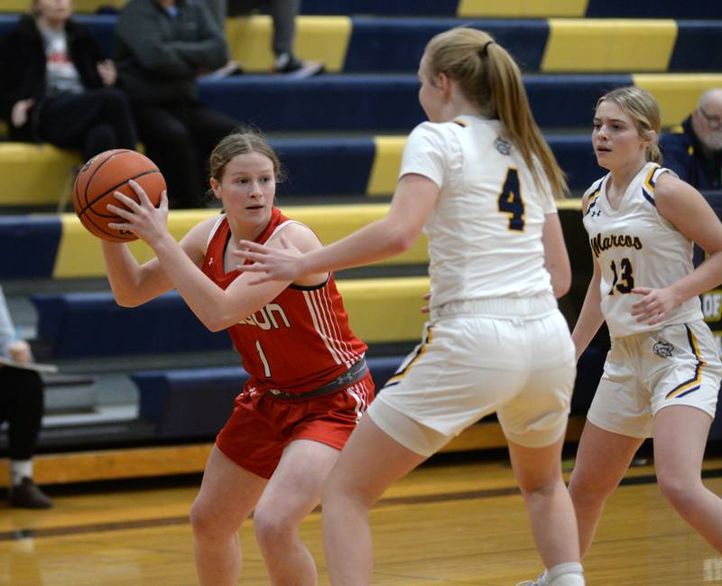 Oregon's Madison Shaffer (1) looks to pass as Polo's Camrynn Jones (4) defends during a Tuesday, Dec. 5, 2023 game at Polo High School.