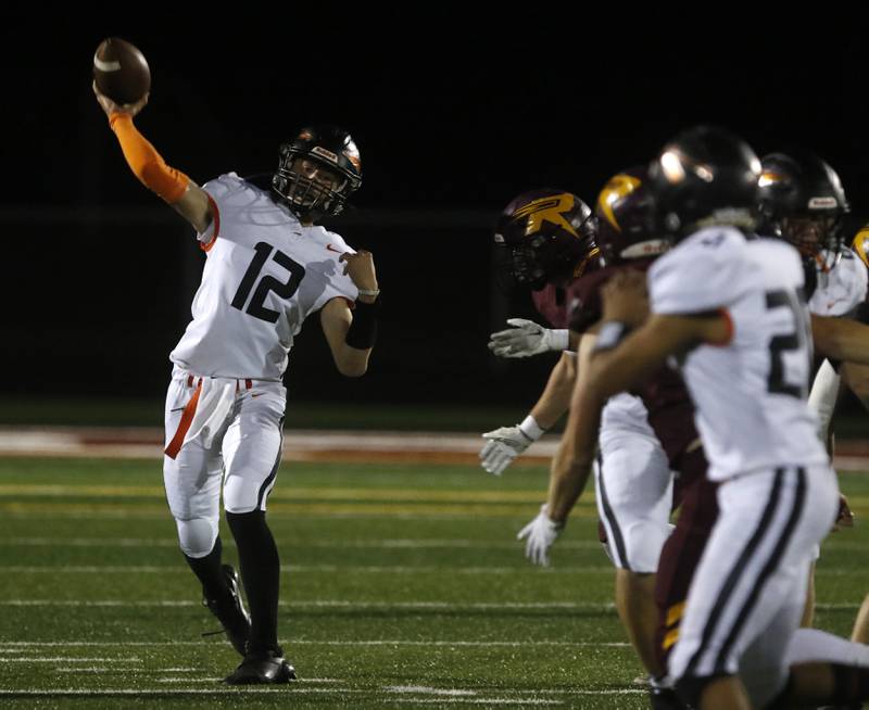 Sandwich's Braden Behringer throws a pass during a Kishwaukee River Conference football game against Richmond-Burton on Friday, Oct. 4, 2024, at Richmond-Burton High School.