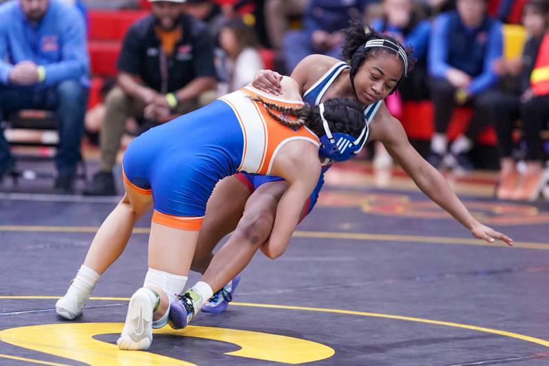 Hoffman Estates’ Sophia Ball shoots the legs of West Aurora’s Aiyanah Sylvester in their 120 pound championship match during the Schaumburg Girls Wrestling Sectional at Schaumburg High School on Saturday, Feb 10, 2024.