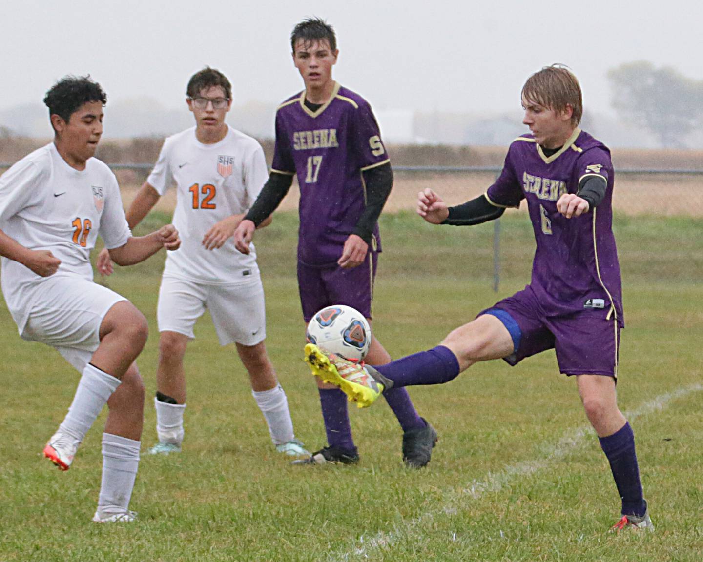 Serena's Tanner Faivre (6) looks to kick the ball past Sandwich's Cesar Garcia (16) in the Class 1A Regional semifinal game on Tuesday, Oct. 11, 2022 in Serena.