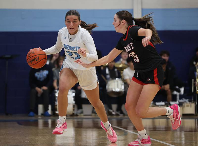 Nazareth’s Danielle Scully (23) handles the ball against Benet during a girls varsity basketball game on Monday, Jan. 29, 2024 in La Grange Park, IL.