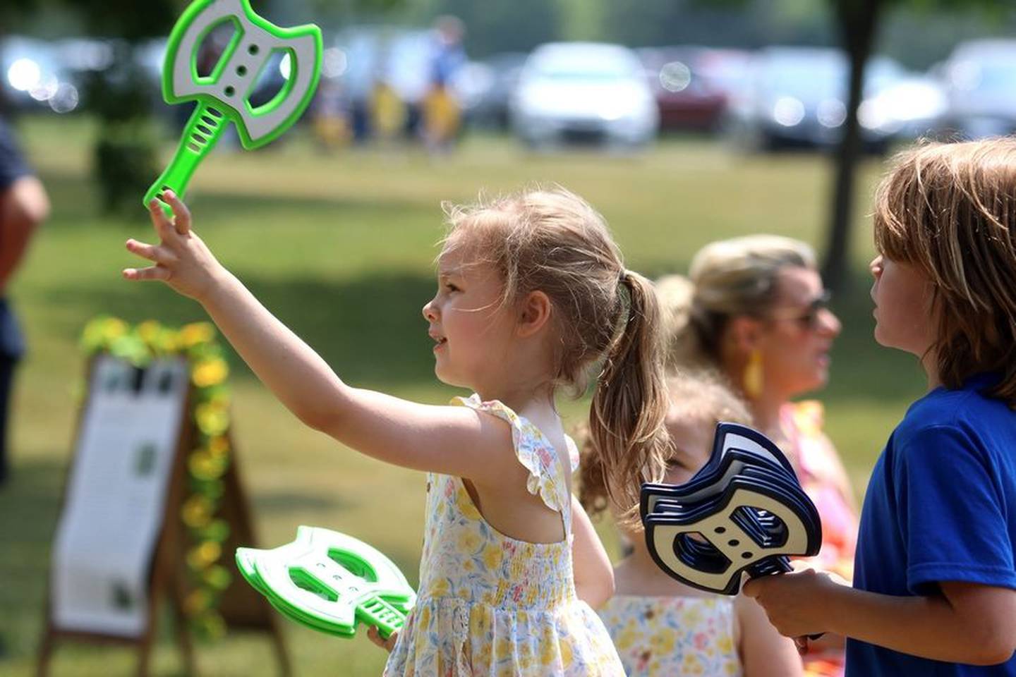 Charlie Naugle, 5, of Winfield tosses axes during the 113th Swedish Day Midsummer Festival at Good Templar Park in Geneva Sunday.