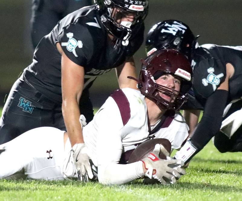 Marengo’s Parker Mandelky looks up after crossing the goal line with a touchdown against Woodstock North in varsity football at Rod Poppe Field on the campus of Marengo High School in Marengo on Friday, Sept. 12, 2025.