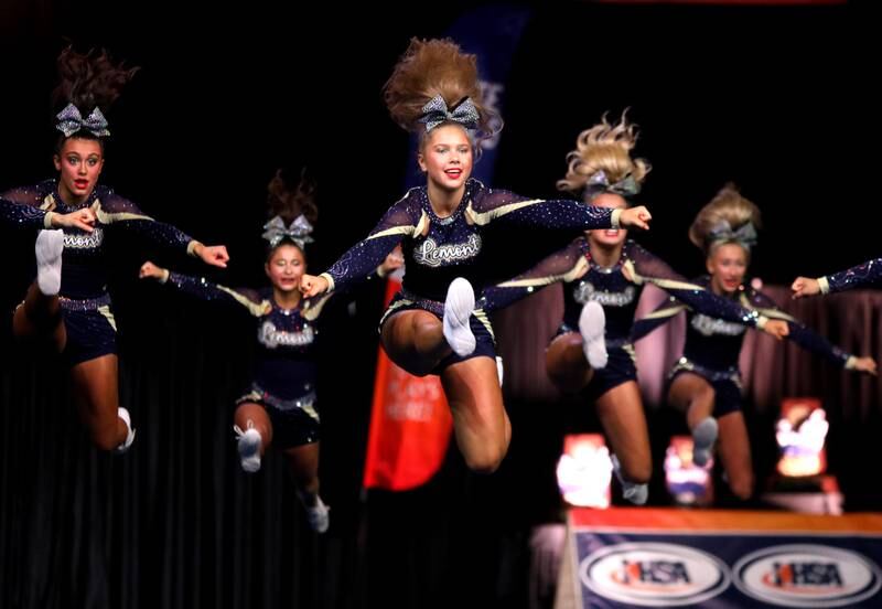 Members of the Lemont cheerleading team compete in the medium team division of the IHSA State Finals on Saturday, Feb. 8, 2025 at Grossinger Motors Arena in Bloomington.
