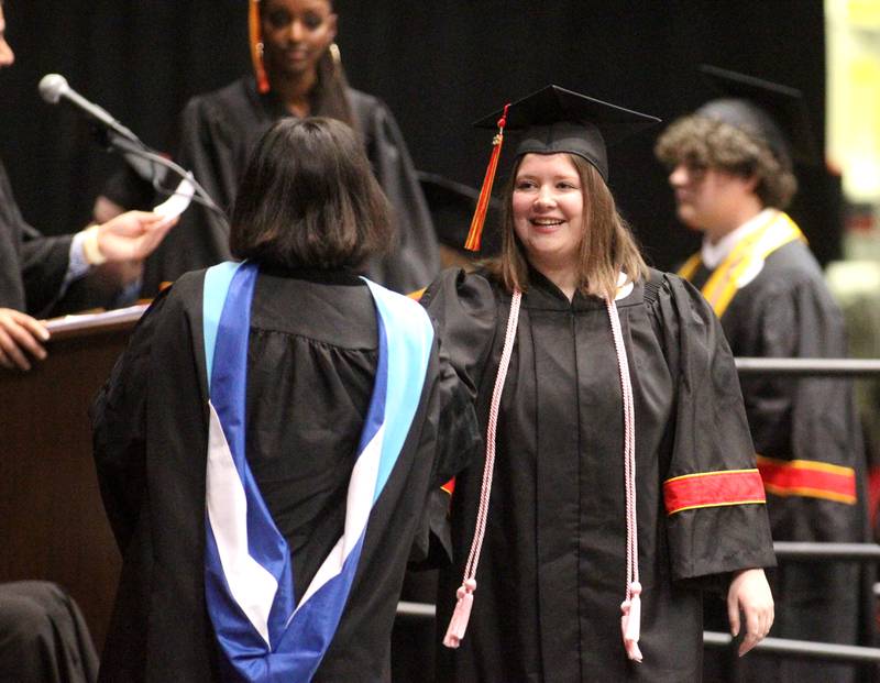 Batavia High School graduate Abigail Piwowarczyk crosses the stage during the 2022 Batavia High School Commencement Ceremony at the Northern Illinois University Convocation Center in DeKalb on Wednesday, May 25, 2022.