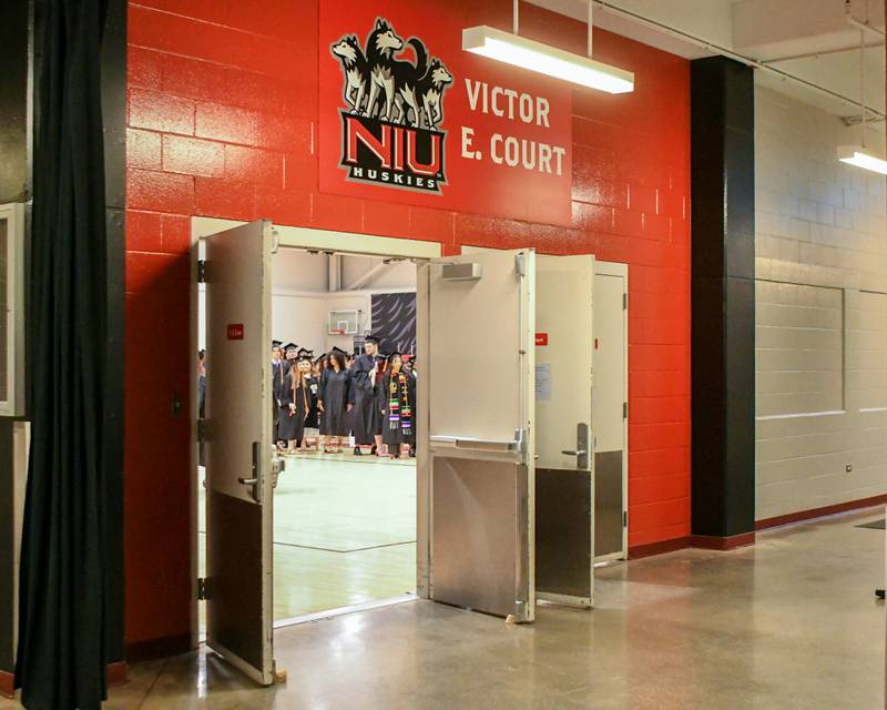 DeKalb High School graduates line up in the Victor E. Court gym at the Northern Illinois University Convocation Center in DeKalb before taking part in the commencement ceremony on Saturday, May 25, 2024.