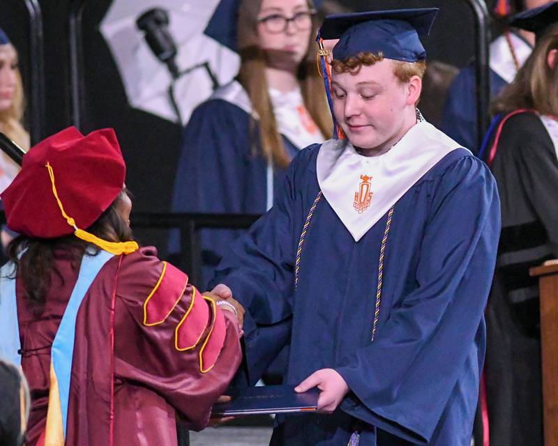 Oswego High school senior Jack Batteman is all smiles after receiving his diploma on Saturday May 17, 2025, during the graduation Ceremony held at the Convocation Center in DeKalb.