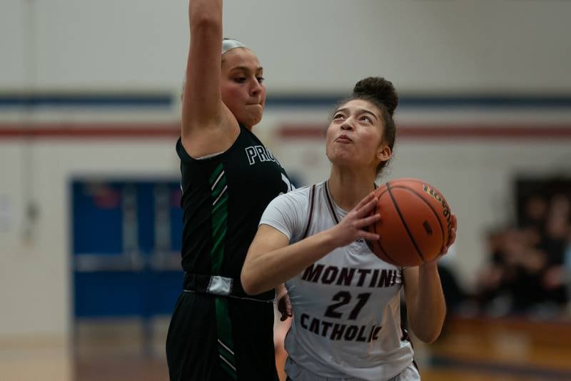 Montini’s Alyssa Epps (21) plays the ball in the post against Providence's Annalise Pietrzyk (23) during the 3A Glenbard South Sectional basketball final at Glenbard South High School in Glen Ellyn on Thursday, Feb 23, 2023.