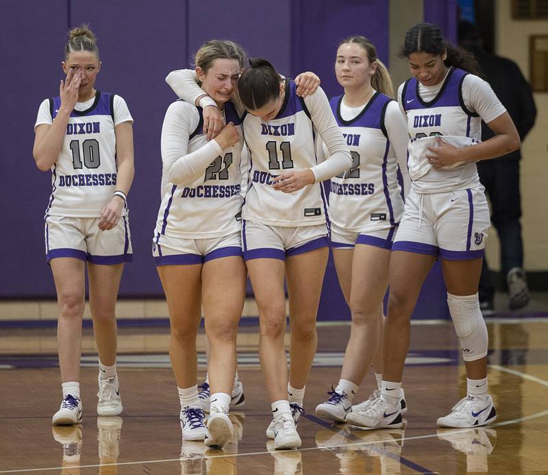 The Dixon Duchesses come off the court after falling to Geneva Thursday, Feb. 19, 2026, in the Class 3A girls basketball regional title game.