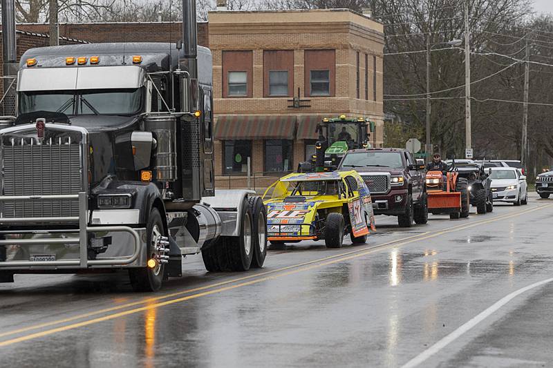 Mourners with vehicles of all kinds proceed Thursday, April 4, 2024 to Riverside Cemetery in Prophetstown in memory of Jayden Hanson.