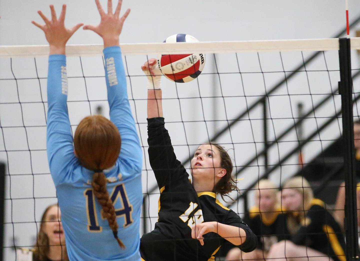 Putnam County's Avery Moutray spikes the ball past Marquette's Maera Jimenez on Thursday, Sept 7, 2023 at Putnam County High School.