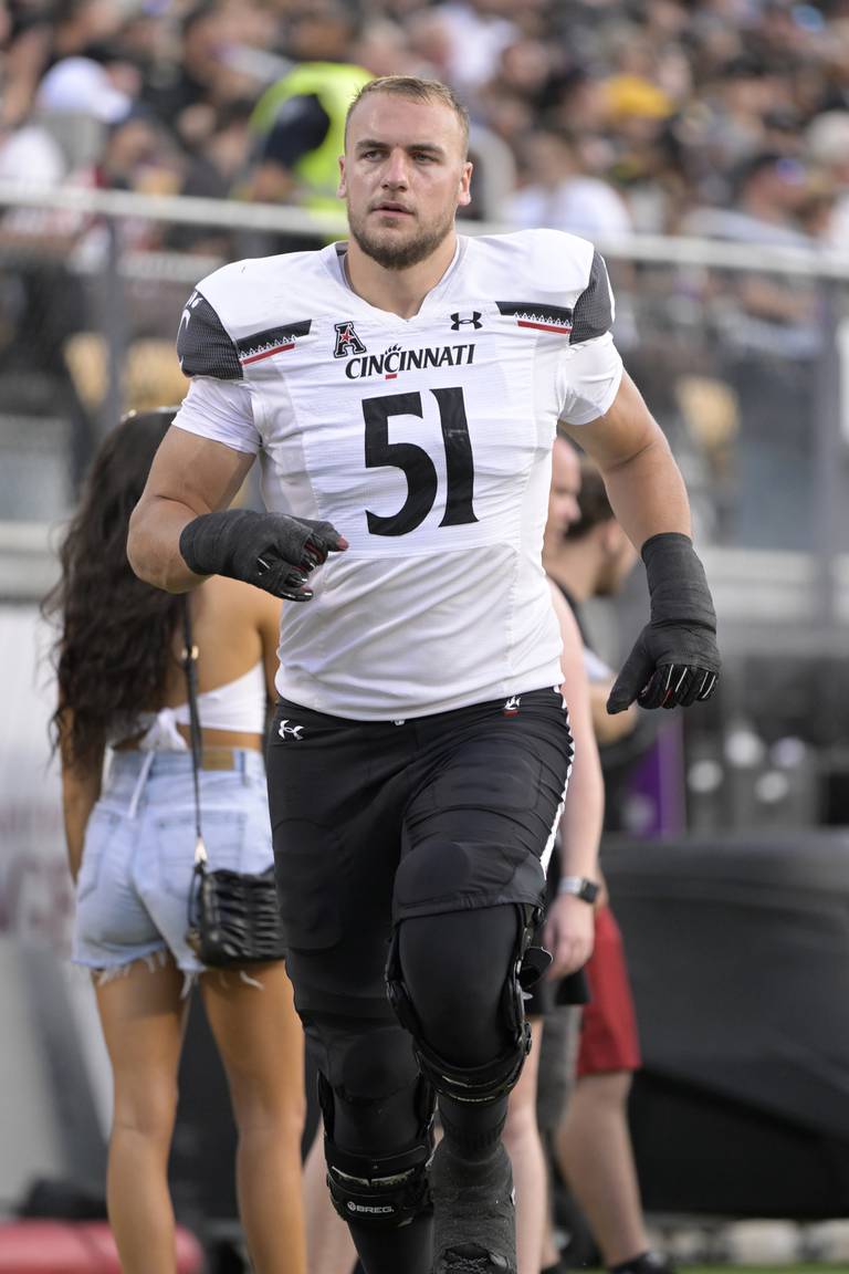 Cincinnati offensive lineman Lorenz Metz jogs to the locker room during the second half against Central Florida, Saturday, Oct. 29, 2022, in Orlando, Fla.