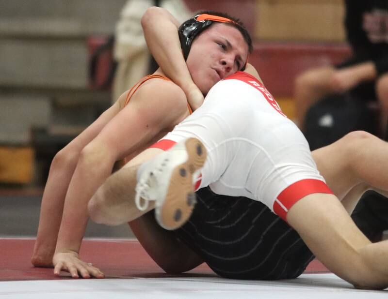 Crystal Lake Central’s Brandon Carbone looks for an escape against Huntley’s Gavin Nischke at 138 pounds in varsity wrestling on Friday, Dec. 13, 2024 at Huntley High School in Huntley.