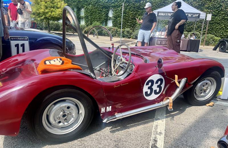 Eva Pribel proudly displays her father's restored self-built racing car at Geneva's Concours d’Elegance car show.
