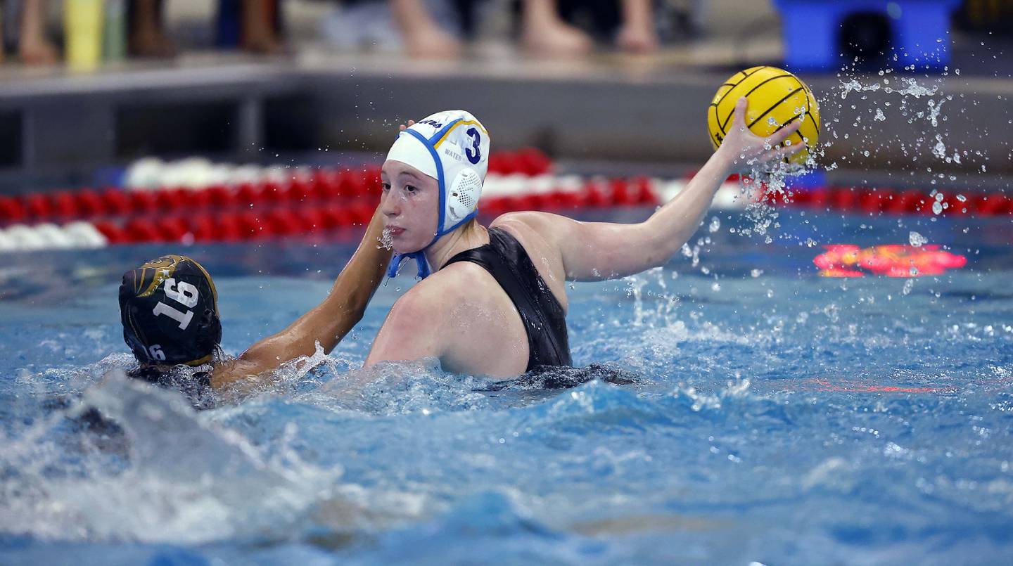 Lyons Township's Isabella Recker (3) looks to shoot past Stevenson's Allison Bichkoff (13) during the IHSA State Finals of the Girls Water Polo Saturday, May 24, 2025 at Stevenson High School in Lincolnshire.