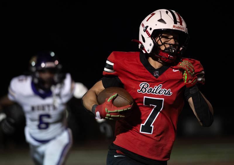 Bradley-Bourbonnais' Isaac Allison carries the ball on a play in a game against T.F. North on Friday, August 29, 2025.