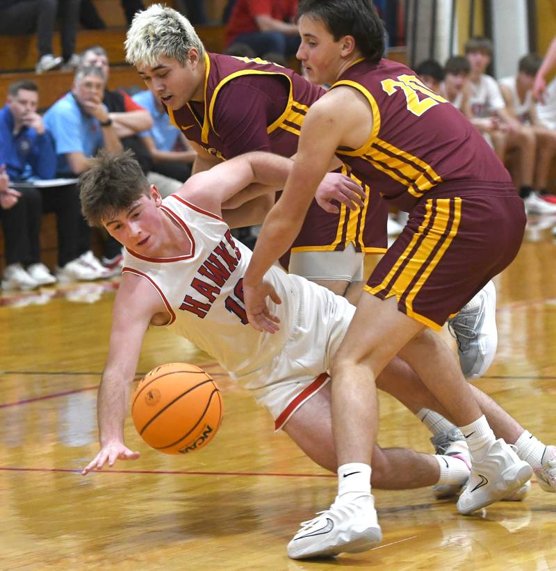 Oregon's Keaton Salsbury (10) knocks the ball loose against Stockton on Saturday, Dec. 13 at the 64th Annual Forreston Holiday Basketball Tournament held at Forreston High School.