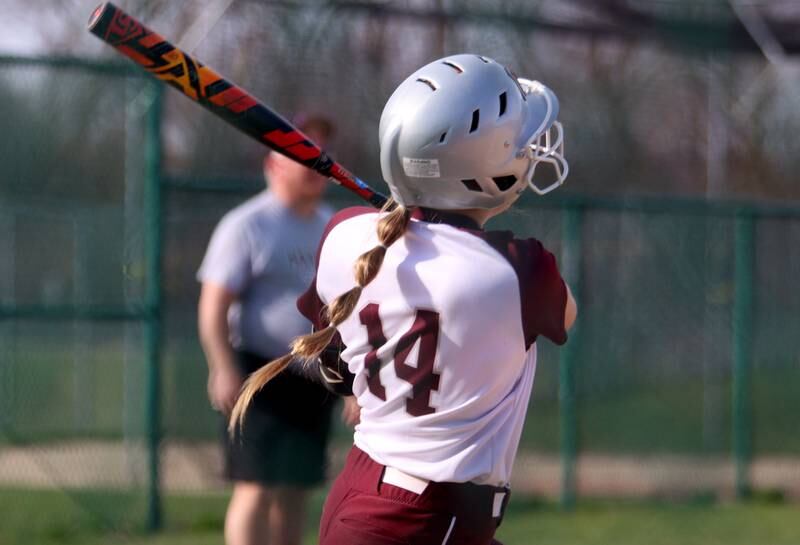 Marengo’s Kylee Jensen connects for a home run against Richmond-Burton in varsity softball at Marengo Tuesday.