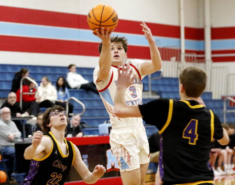 Marian Central's Mark Jablonski shoots the ball over Chicago Christian's Isaac Heerdt (left) and Eddie VanDellen (right) during a Chicagoland Christian Conference basketball game on Tuesday, Jan. 21, 2025, at Marian Central High School.