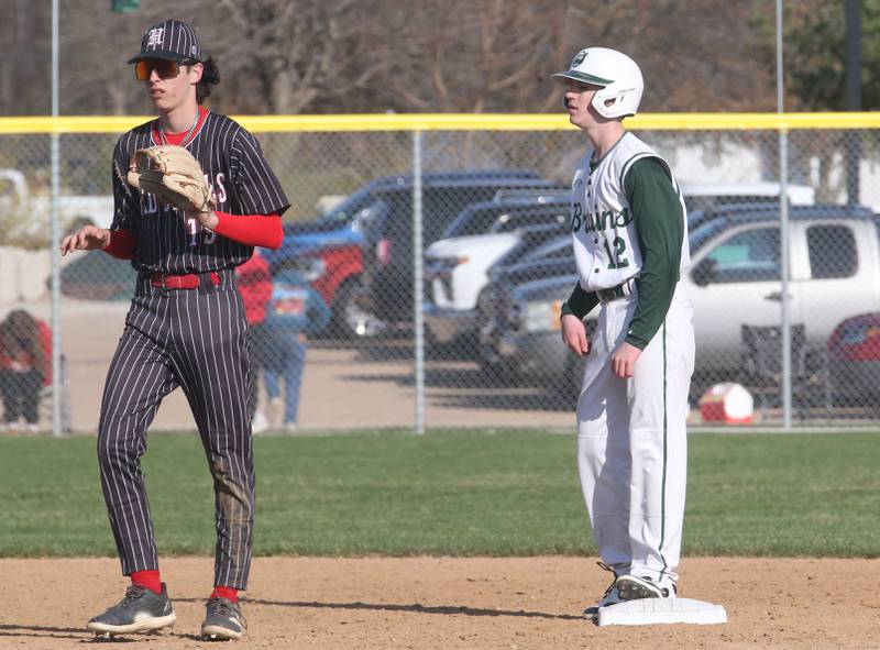 St. Bede's AJ Hermes stands safely on second base while stealing the bag as Hall's Noah Plym waits for the late throw on Monday, March 31, 2025 at Schweickert Stadium in Peru.