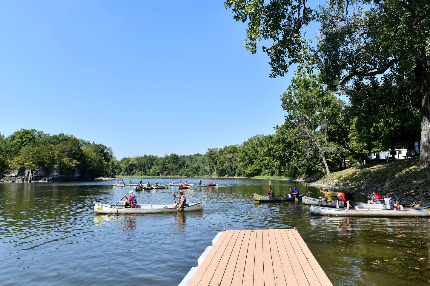 Volunteers head out on the Kankakee River to collect trash during the 39th Annual Kankakee and Iroquois River Cleanup in 2021. The group has been volunteering since 1988, this year bringing nearly 60 kids in total throughout the day to help with the environmental effort.