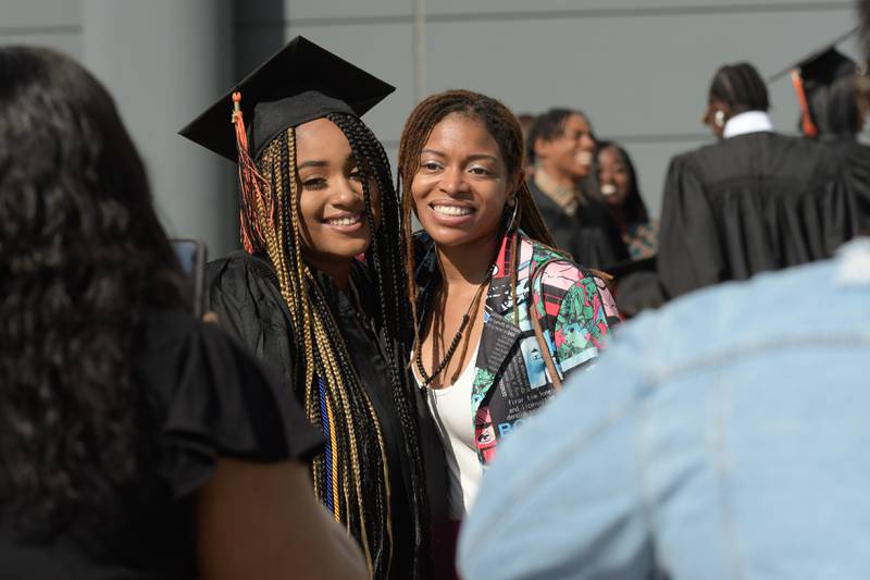 Brianna Robinson poses for a photo with her aunt, Crystal Simon, before the DeKalb High School graduation ceremony at the Convocation Center in DeKalb on Saturday, May 28, 2022.