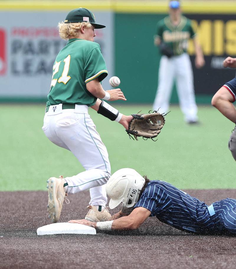 Nazareth's Jacob Castaneda slides in safely with a stolen base as Crystal Lake South's Dayton Murphy tries to corral the throw Friday, June 10, 2022, during their IHSA Class 3A state semifinal game at Duly Health and Care Field in Joliet.