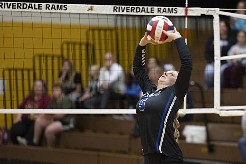 Newman’s Molly Olson sets the ball against Rock Falls Thursday, Oct. 26, 2023 in the class 2A regional finals at Riverdale.