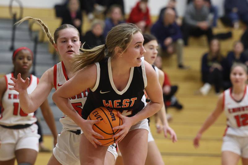 Lincoln-Way West’s Reagan McCracken looks to pass against Lincoln-Way Central on Tuesday, Jan 28, 2025 in New Lenox.
