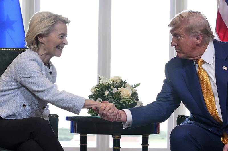 President Donald Trump and European Commission President Ursula von der Leyen shake hands after reaching a trade deal at the Trump Turnberry golf course in Turnberry, Scotland Sunday, July 27, 2025. (AP Photo/Jacquelyn Martin)