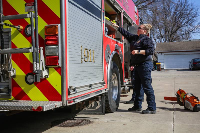 Harvard Fire Protection District firefighters check supplies and gear on Tuesday, March 11, 2025.