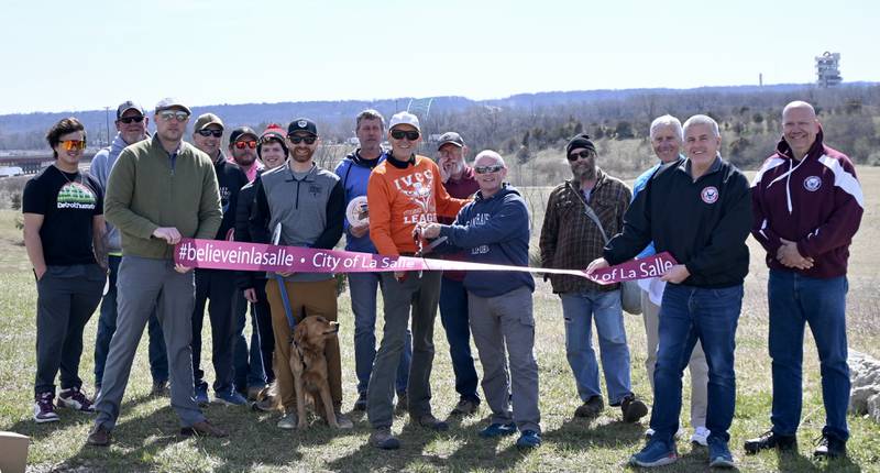 A new disc golf course, named The Quarry, celebrated its grand opening Tuesday, with a ribbon-cutting ceremony attended by public officials, local disc golfers and residents.