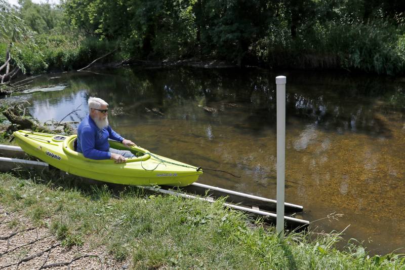 Gary Theall shows how the lack launch into the Kishwaukee River works on Monday, June 17, 2024, at Siems Memorial Park near Union. Members of the Paddle the Kish group have finished clearing the Kishwaukee River between Union Marengo area so it can be paddled in kayaks.