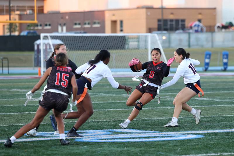 Yorkville's Bella Esquivel runs the ball as Oswego's Thalia Aburto, right, closes in during the Foxes' 2-1 overtime victory over Oswego in the IHSA Kankakee Regional championship game on Thursday, Oct. 9, 2025.