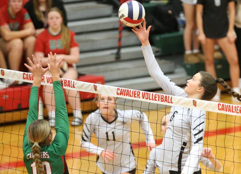 Kaneland's Grace Remsen taps the ball past L-P's Kelsey Frederick in AJ Sellett Gymnasium on Thursday, Oct. 24, 2024 at L-P High School.
