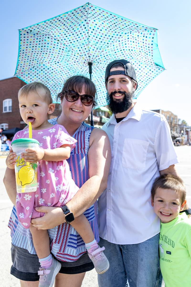 The Stack family, Adalyn, Katelyn, Brandan, and Aidan, enjoys the Grundy County Corn Festival Parade in Downtown Morris on Sept. 28, 2025.