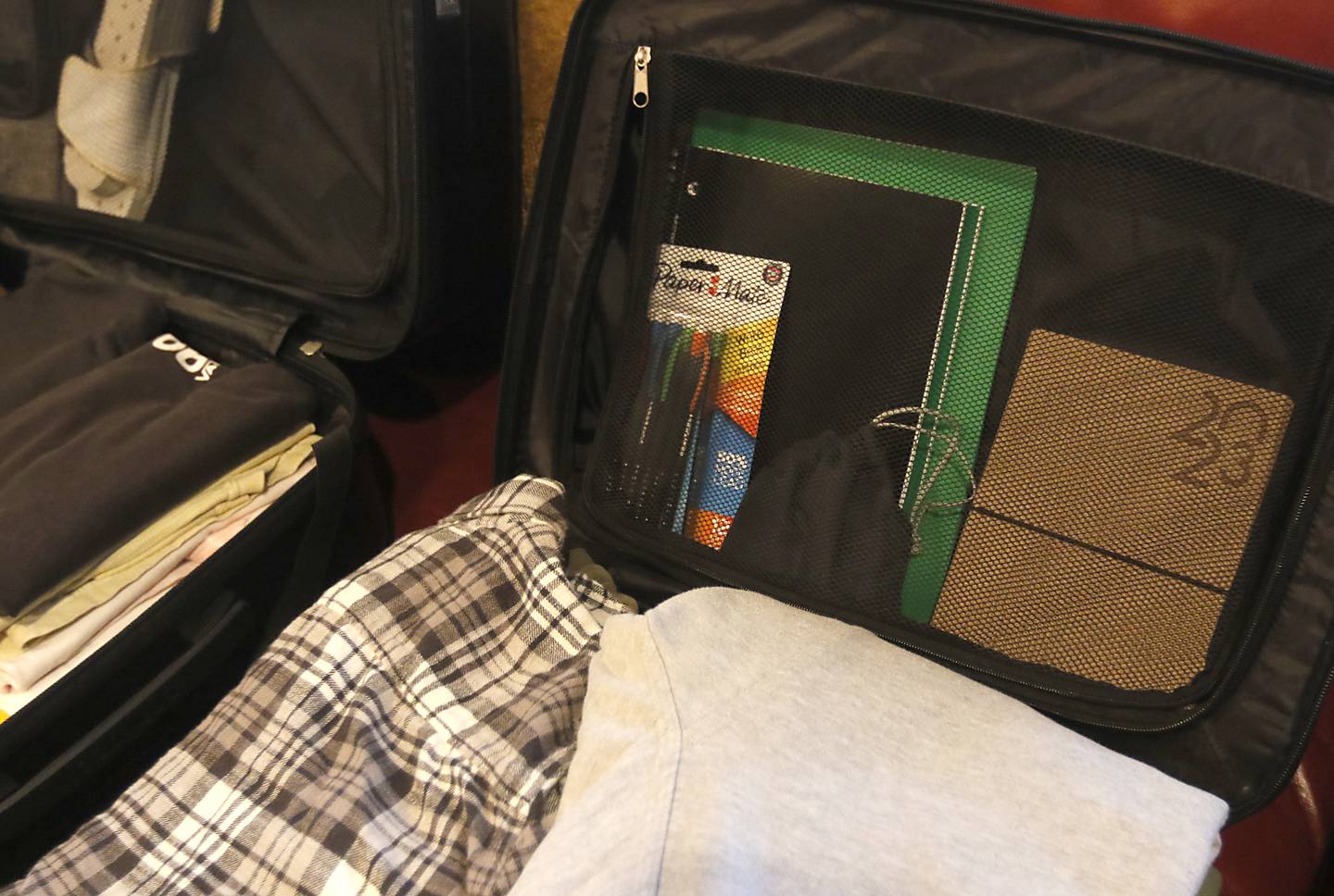 School supplies that Brady Bird of Lake in the Hills has packed in his suitcase Thursday, Jan. 19, 2023, as he prepares to travel to Canterbury Christ Church University in Canterbury, England. Bird is going to be McHenry County College's first study abroad student since March 2020.